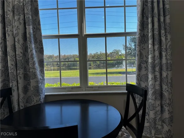 a view of a room with a large window