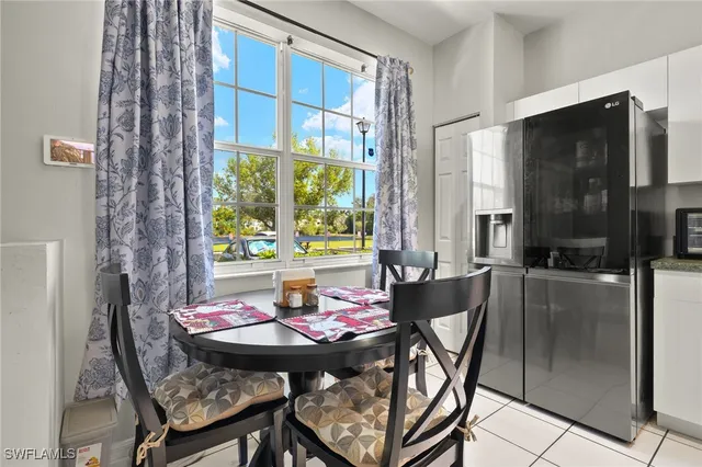 a view of a dining room with furniture and window