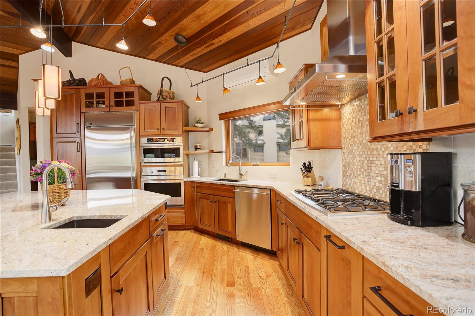 2420 Juniper Court Golden, CO 80401 - Photo 11 of 48 a kitchen with stainless steel appliances granite countertop a sink stove and refrigerator