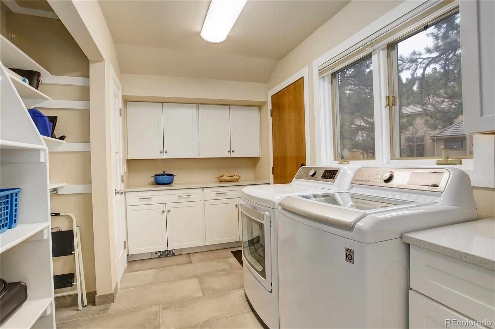 2420 Juniper Court Golden, CO 80401 - Photo 13 of 48 a view of living room with washer and dryer