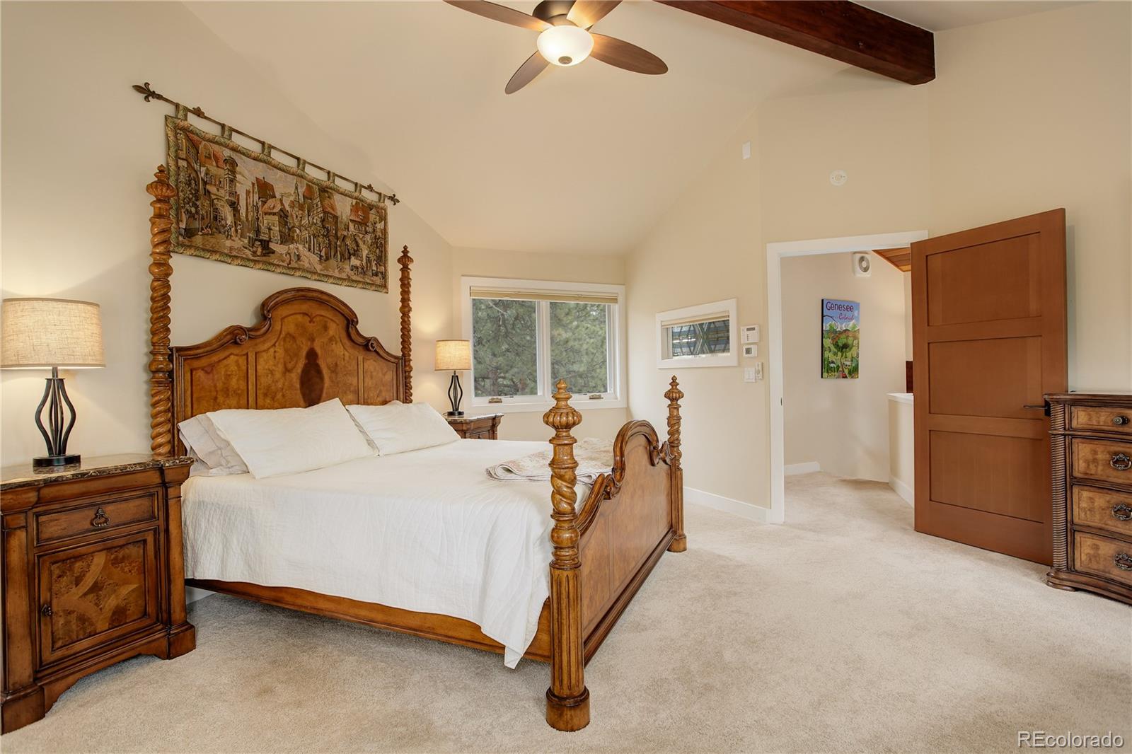2420 Juniper Court Golden, CO 80401 - Photo 17 of 48 a bed room with a bed and a dresser