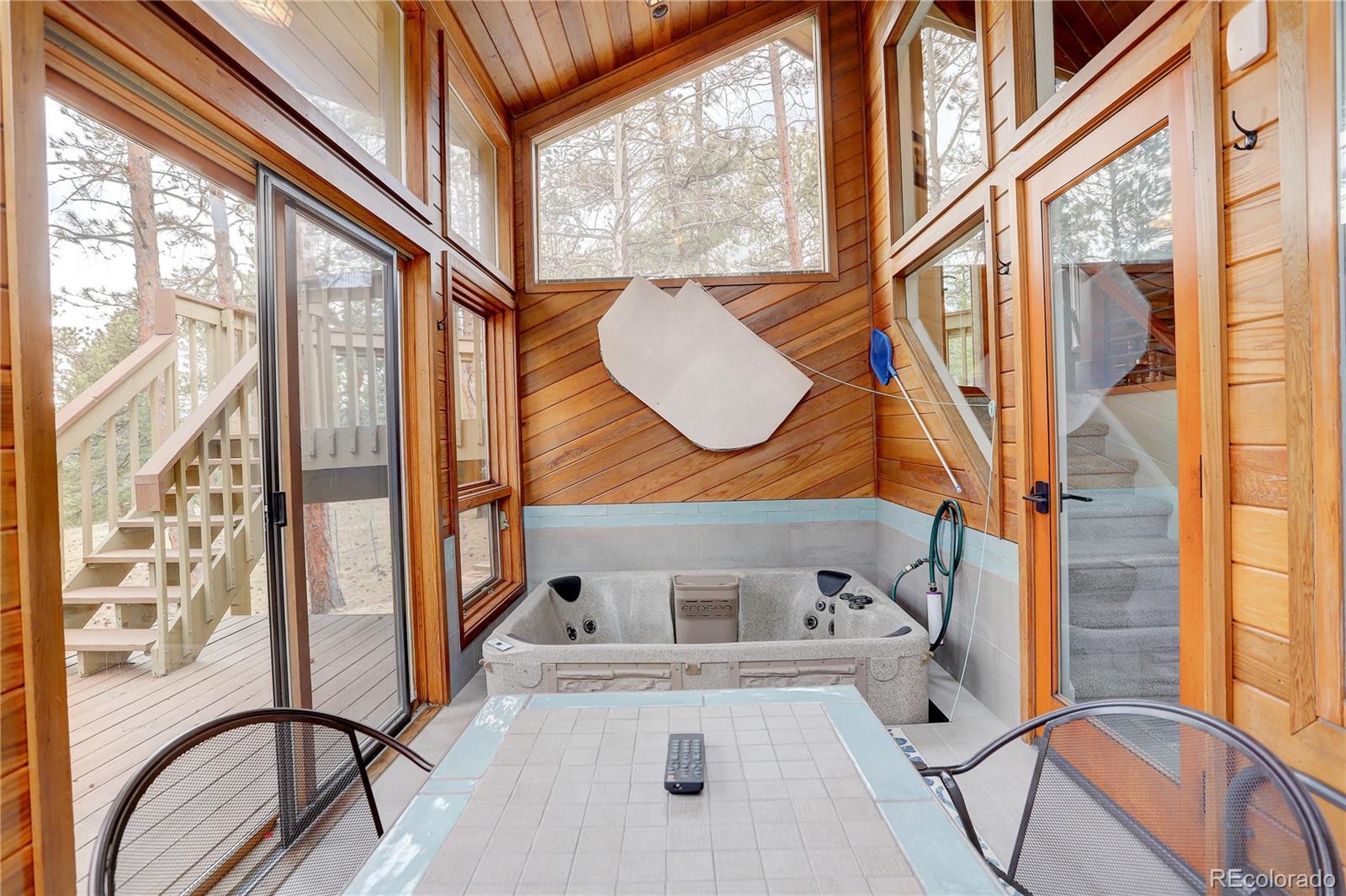 2420 Juniper Court Golden, CO 80401 - Photo 20 of 48 a bathroom with a bathtub and a window