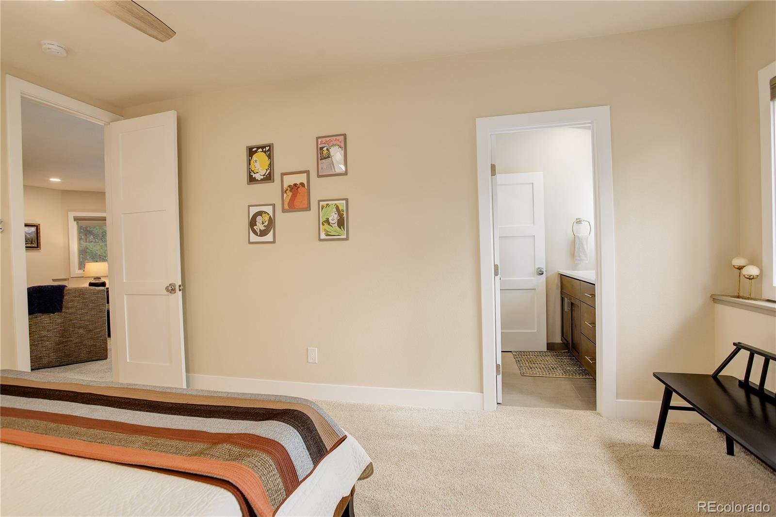 2420 Juniper Court Golden, CO 80401 - Photo 24 of 48 a bedroom with a bed and a mirror