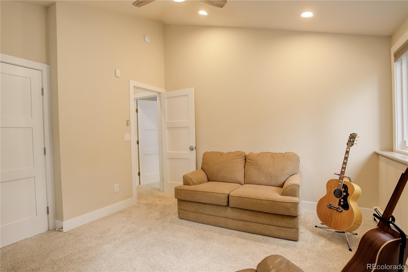 2420 Juniper Court Golden, CO 80401 - Photo 27 of 48 a living room with furniture and a couch