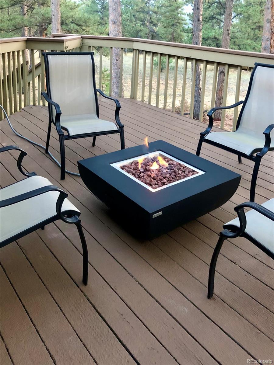 2420 Juniper Court Golden, CO 80401 - Photo 31 of 48 a view of a chairs and table in the balcony
