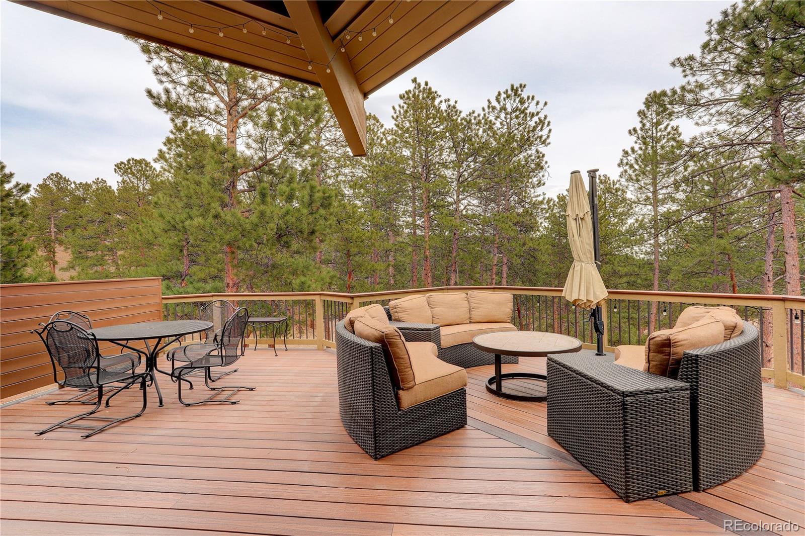 2420 Juniper Court Golden, CO 80401 - Photo 37 of 48 a view of a roof deck with furniture