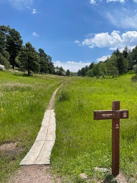 2420 Juniper Court Golden, CO 80401 - Photo 43 of 48 a view of a lake with a yard