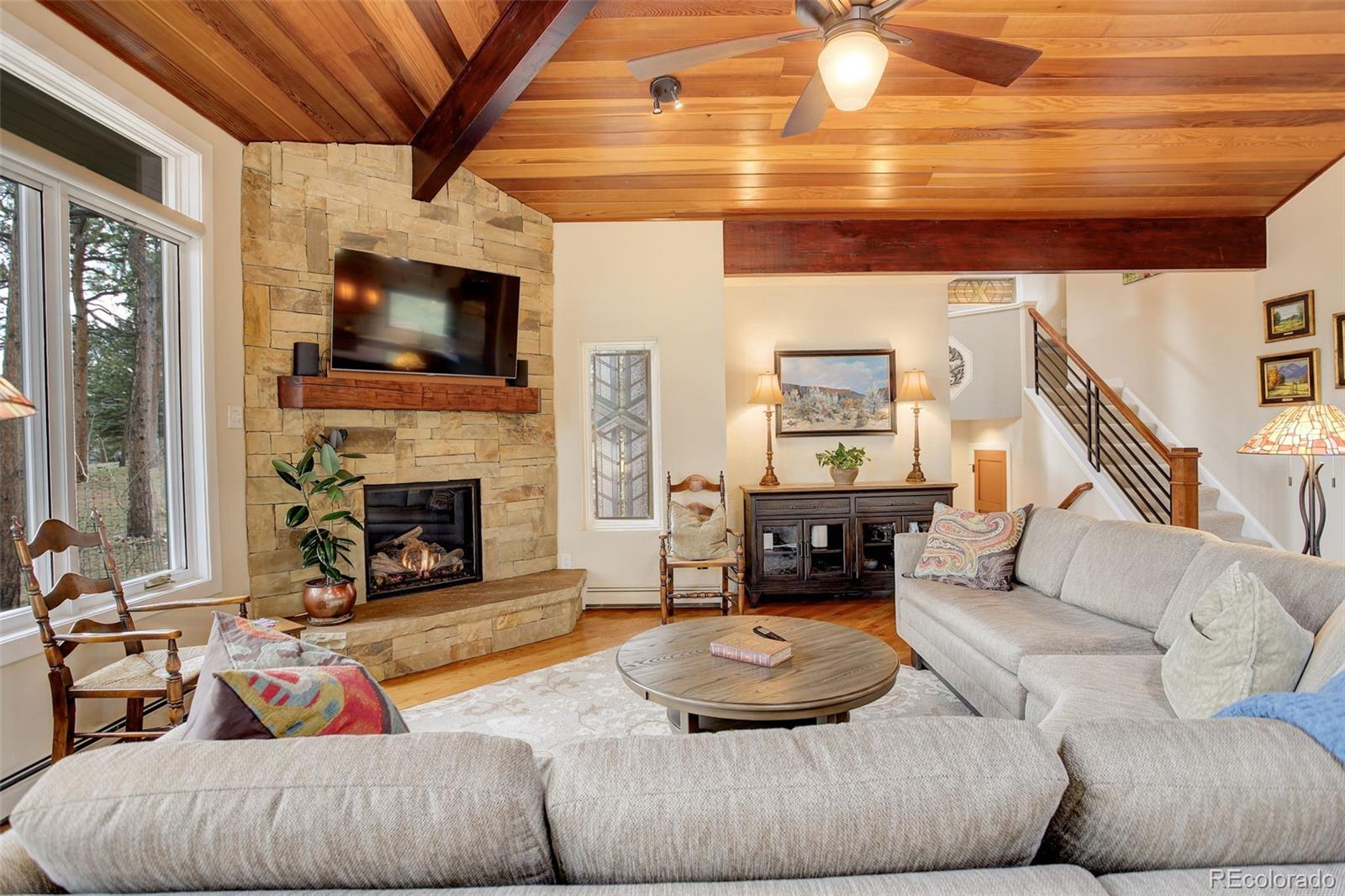 2420 Juniper Court Golden, CO 80401 - Photo 7 of 48 a living room with furniture and a fireplace