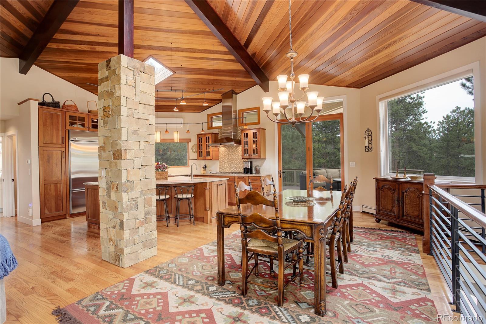 2420 Juniper Court Golden, CO 80401 - Photo 8 of 48 a view of a dining room with furniture window and outside view