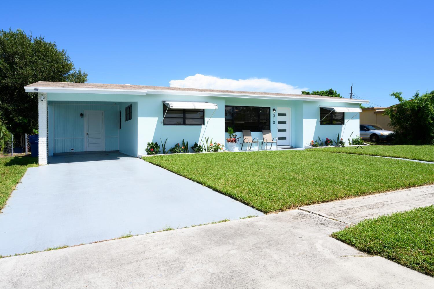 310 West 16th Way Riviera Beach, FL 33404 - Photo 2 of 24 Front Entrance