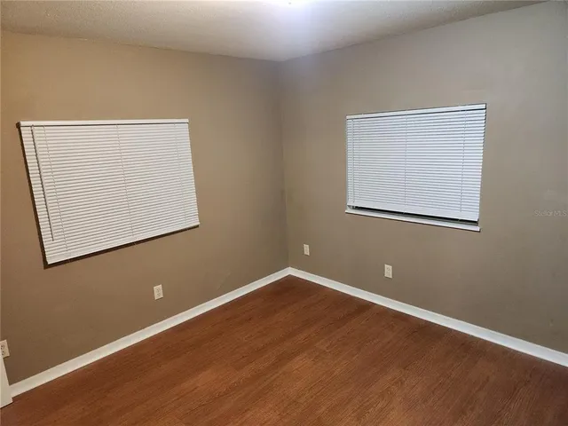 a room with a sink and a mirror