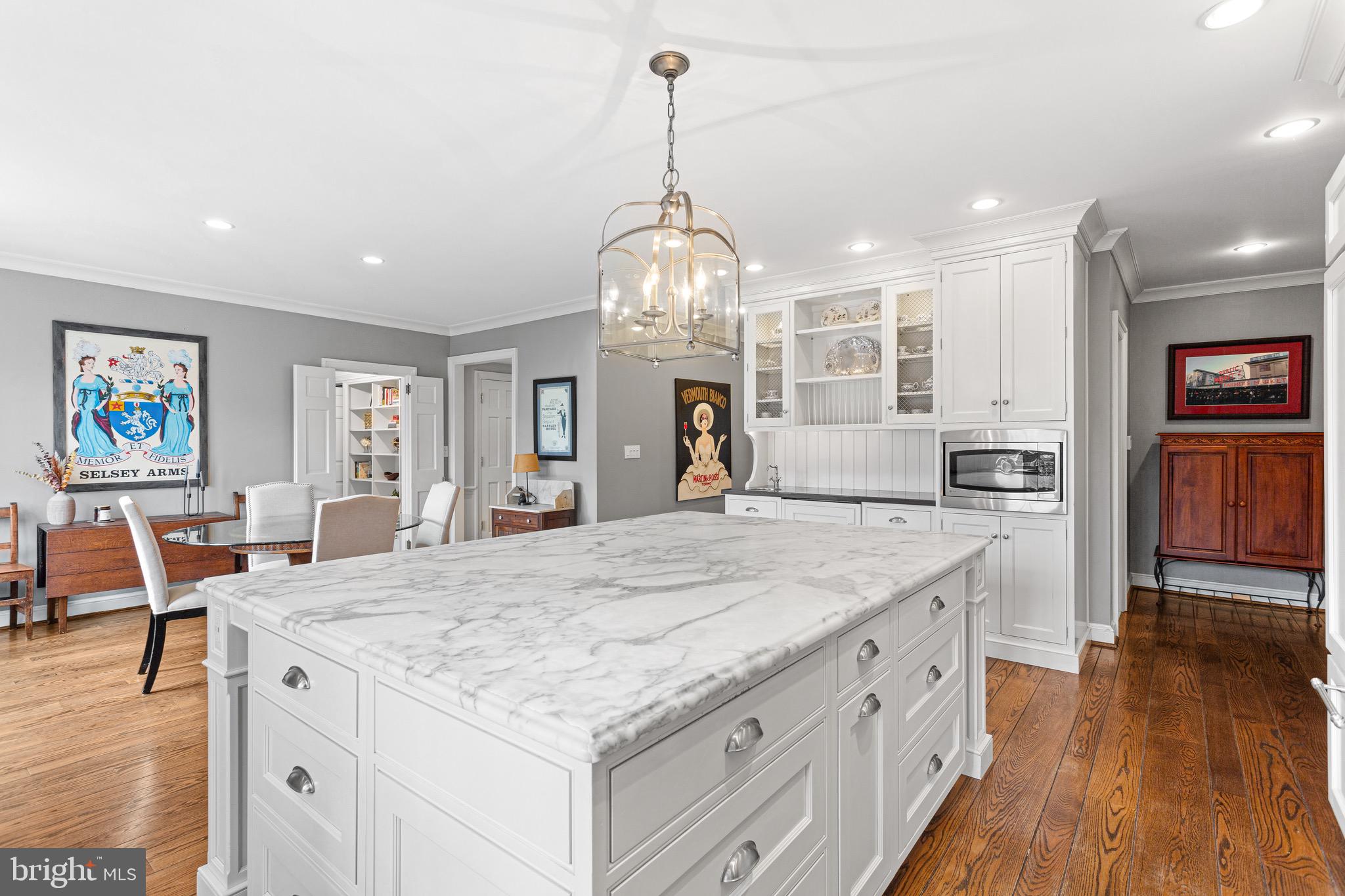 370 Station Avenue Haddonfield, NJ 08033 - Photo 12 of 48 a large kitchen with kitchen island a large island in it