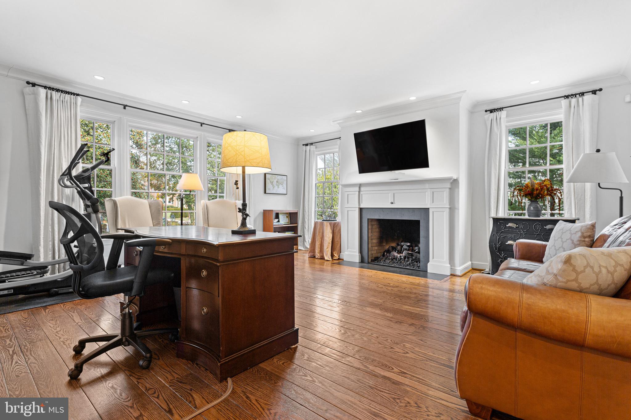 370 Station Avenue Haddonfield, NJ 08033 - Photo 17 of 48 a living room with furniture a flat screen tv and a fireplace
