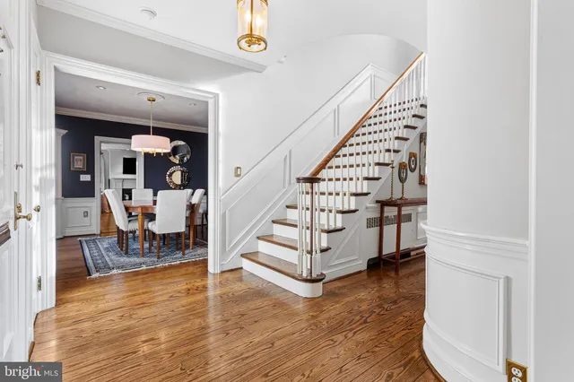 a view of a room with wooden floor and stairs