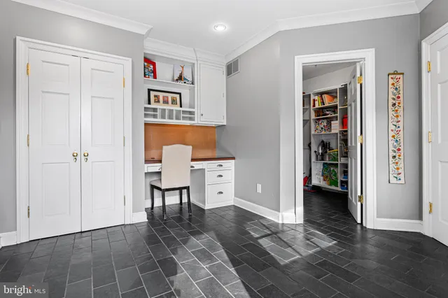 a view of a hallway with seating area