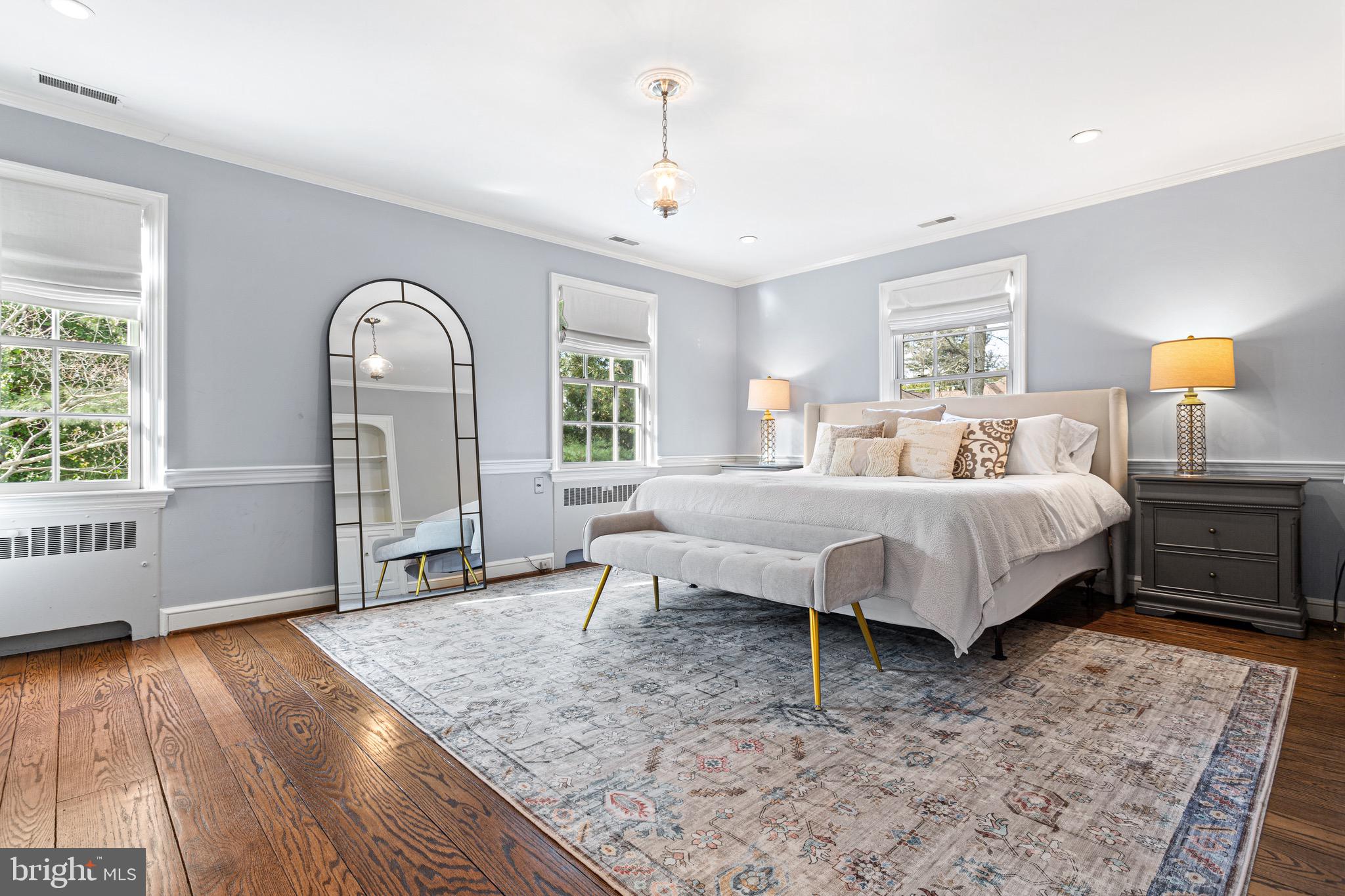 370 Station Avenue Haddonfield, NJ 08033 - Photo 23 of 48 a spacious bedroom with a bed and wooden floor