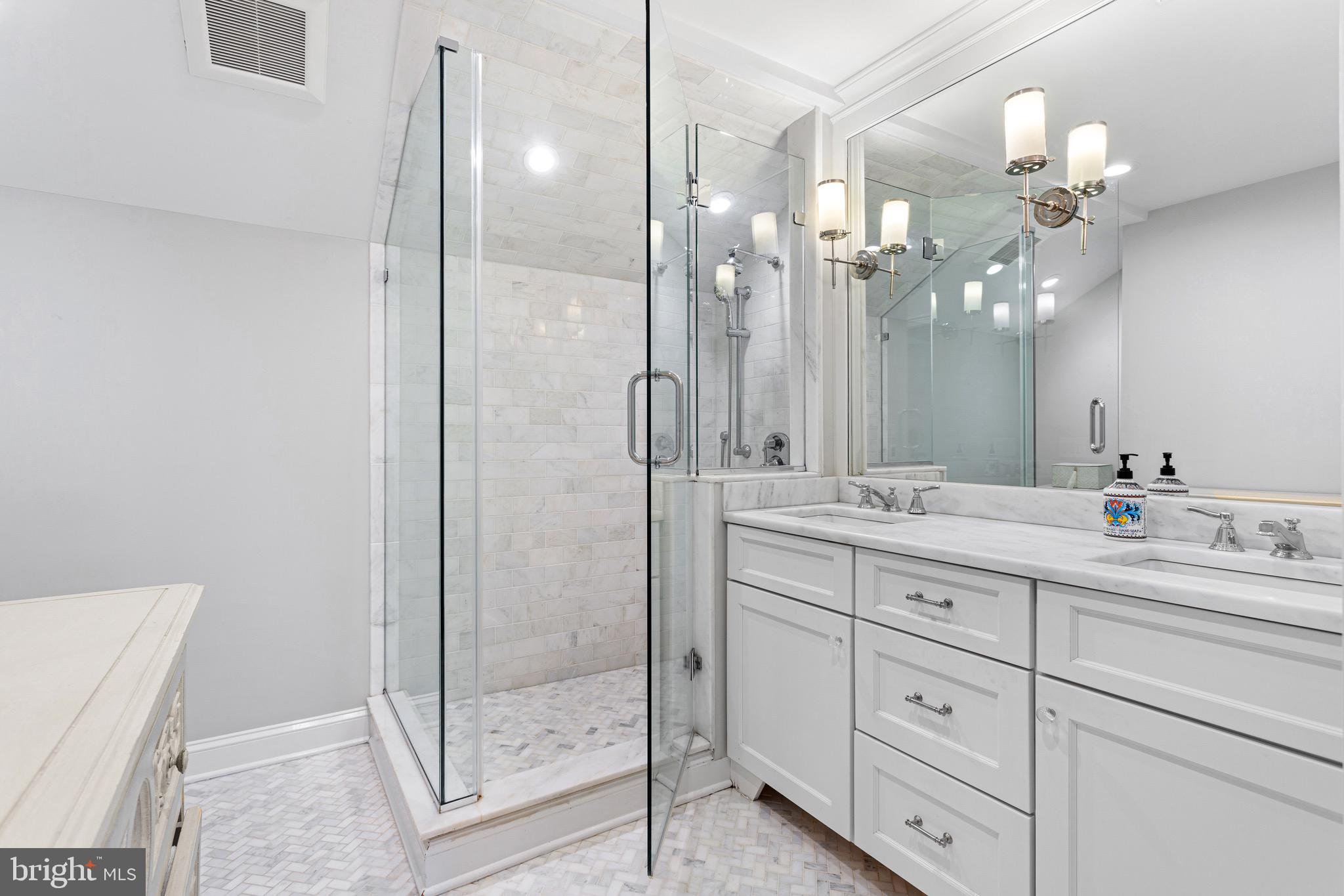 370 Station Avenue Haddonfield, NJ 08033 - Photo 25 of 48 a bathroom with a shower sink and mirror