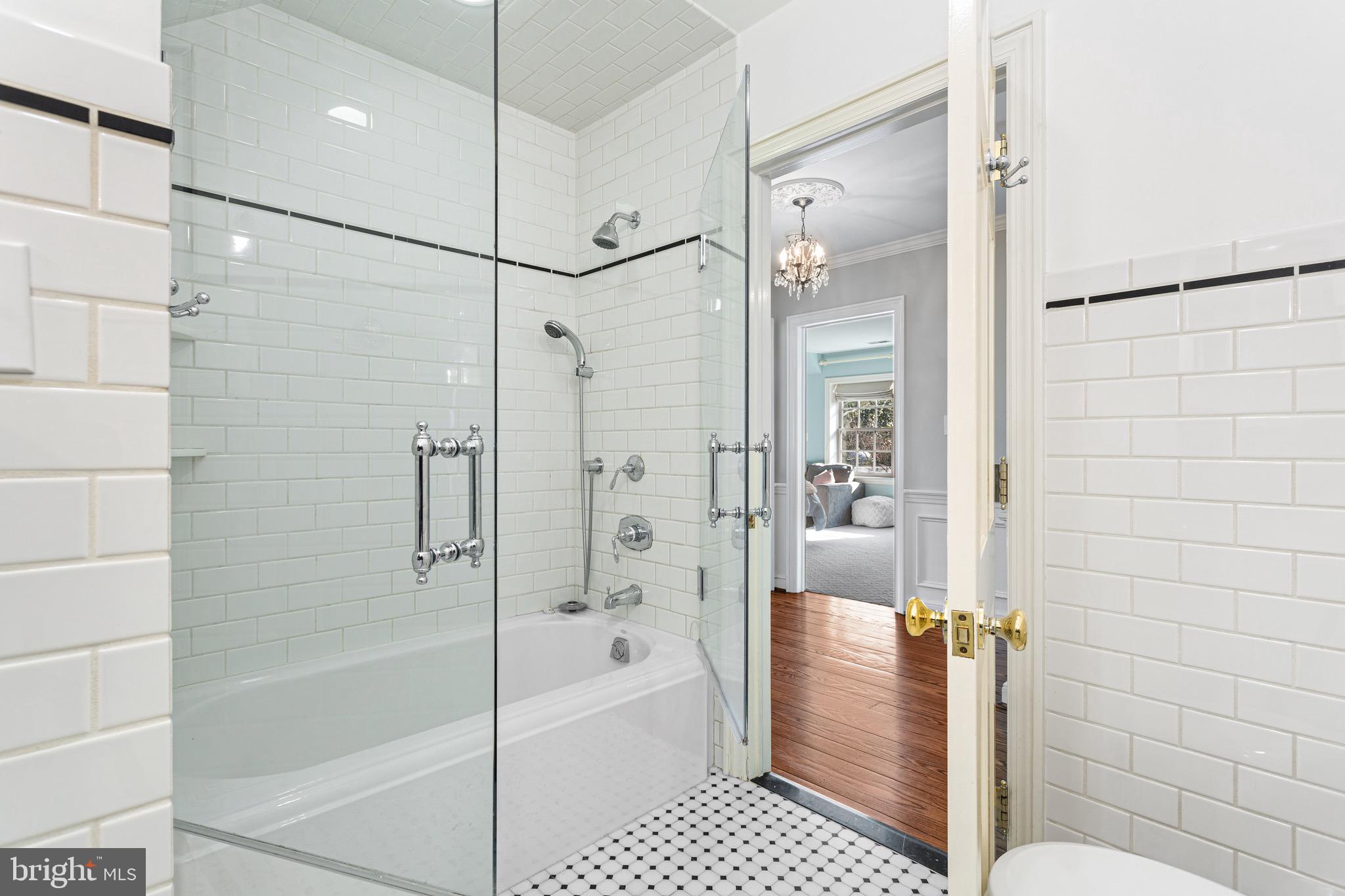 370 Station Avenue Haddonfield, NJ 08033 - Photo 34 of 48 a bathroom with a bathtub and a shower