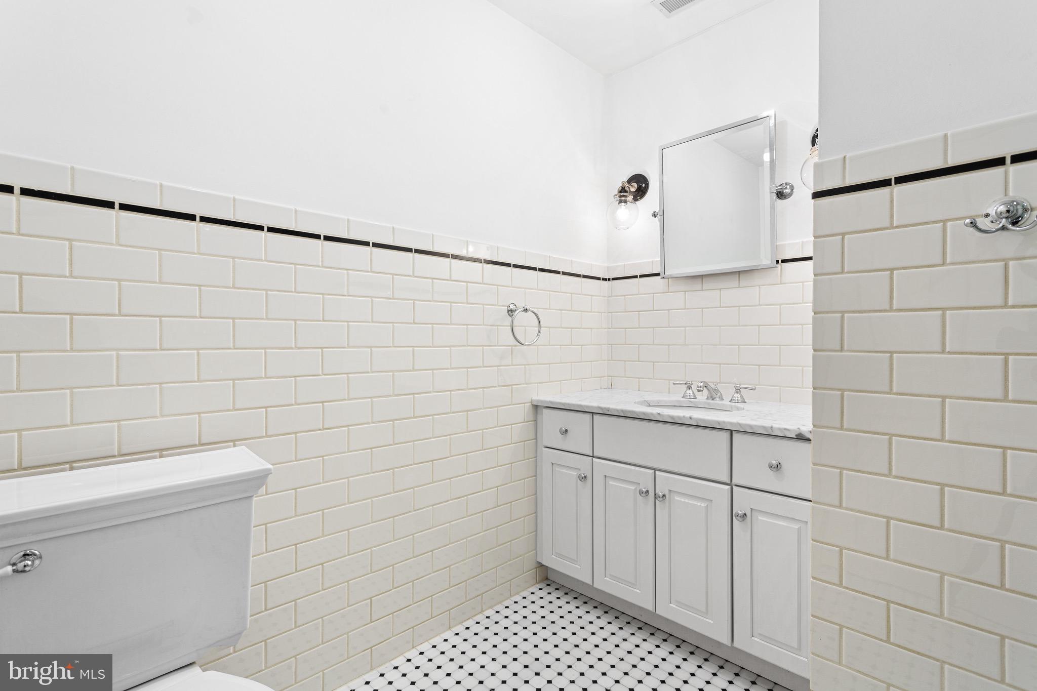 370 Station Avenue Haddonfield, NJ 08033 - Photo 35 of 48 a bathroom with a sink a toilet and shower