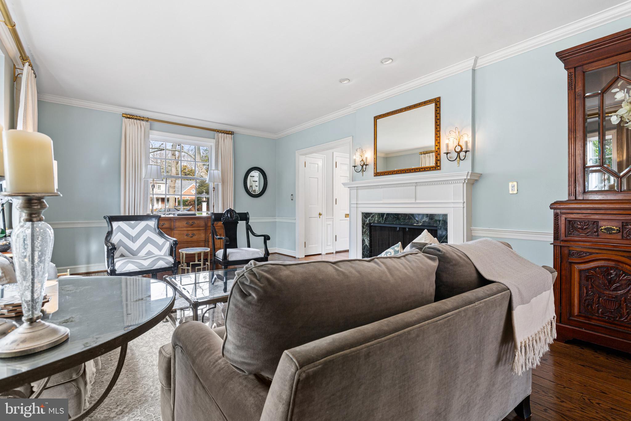 370 Station Avenue Haddonfield, NJ 08033 - Photo 4 of 48 a living room with furniture a fireplace and a window