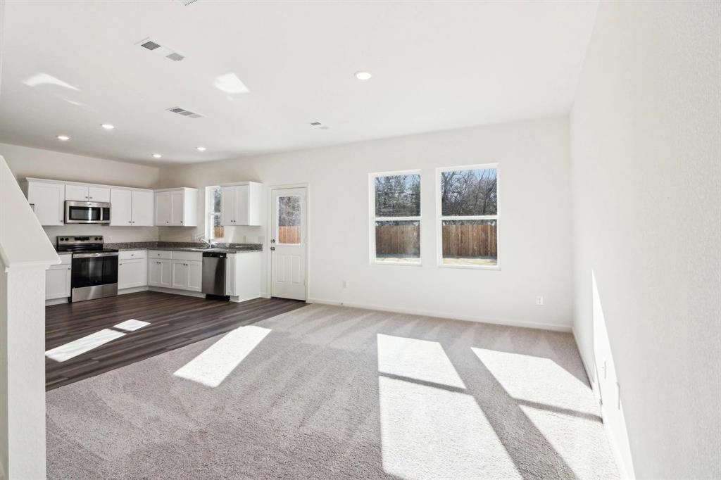 14126 Donahue Street Pilot Point, TX 76258 - Photo 12 of 21 a view of kitchen with windows and refrigerator