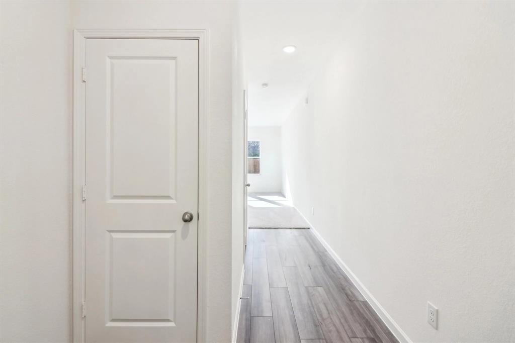 14126 Donahue Street Pilot Point, TX 76258 - Photo 15 of 21 a view of a hallway with wooden floor