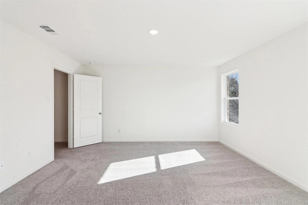 14126 Donahue Street Pilot Point, TX 76258 - Photo 17 of 21 an empty room with a empty space and window