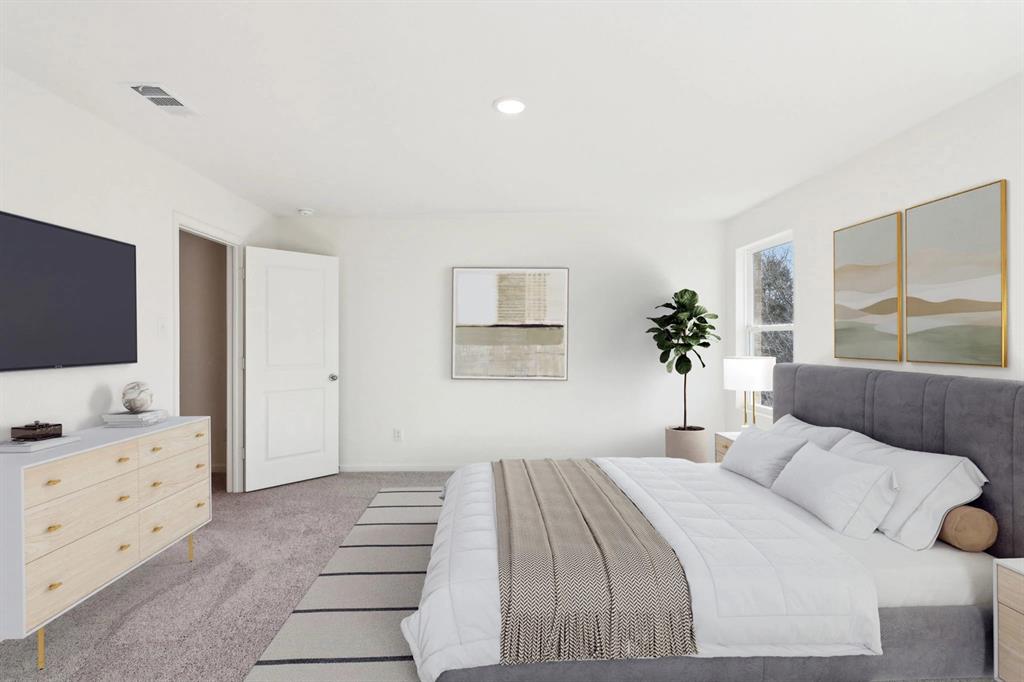 14126 Donahue Street Pilot Point, TX 76258 - Photo 8 of 21 a bedroom with a large bed and a flat tv screen on dresser