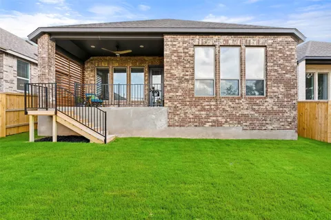 a view of front door of house with yard