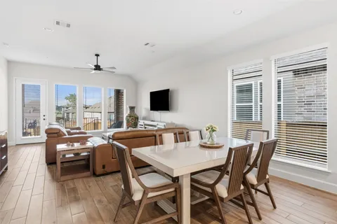 a view of a dining room with furniture window and wooden floor