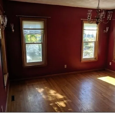 a view of an empty room and window