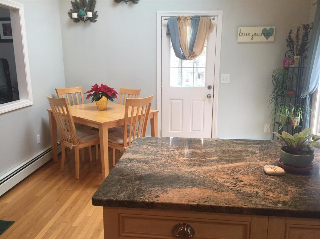 32 Foster Howard Road Pocasset, MA 02559 - Photo 3 of 13 a view of a livingroom with furniture and a potted plant