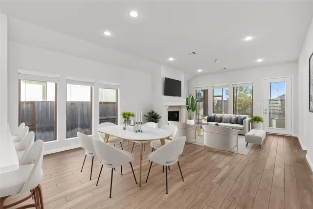 a kitchen with a white stove top oven and white cabinets