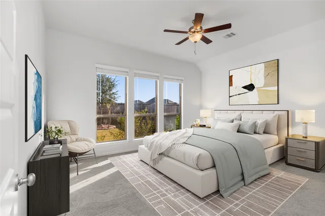 an empty room with windows and ceiling fan view
