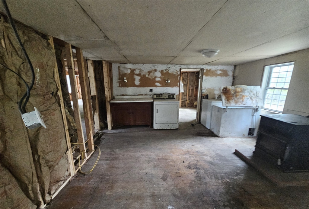 1 Crane Road Chester, MA 01011 - Photo 7 of 12 a view of kitchen with stainless steel appliances wooden floor and window