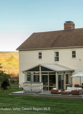 a front view of a house with trees