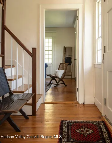 a view of a living room and a rug
