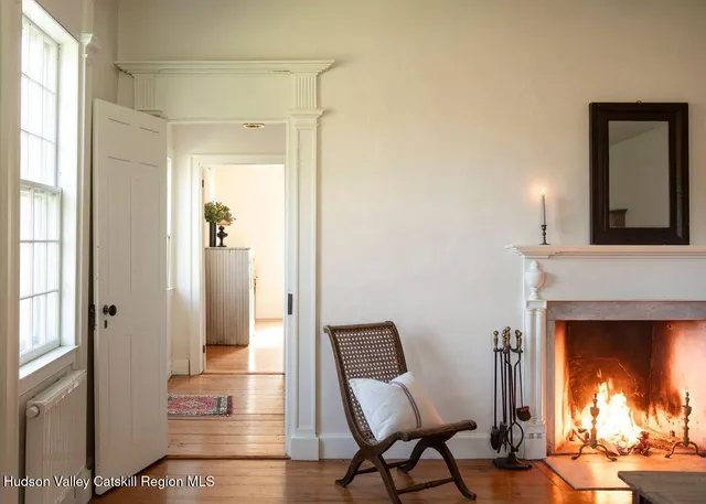 a view of a livingroom with furniture and a fireplace