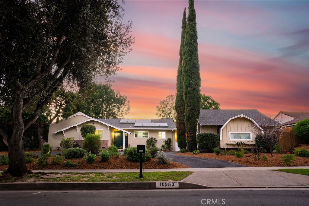 10953 Darby Avenue Porter Ranch, CA 91326 - Photo 1 of 1 a front view of a house with a garden