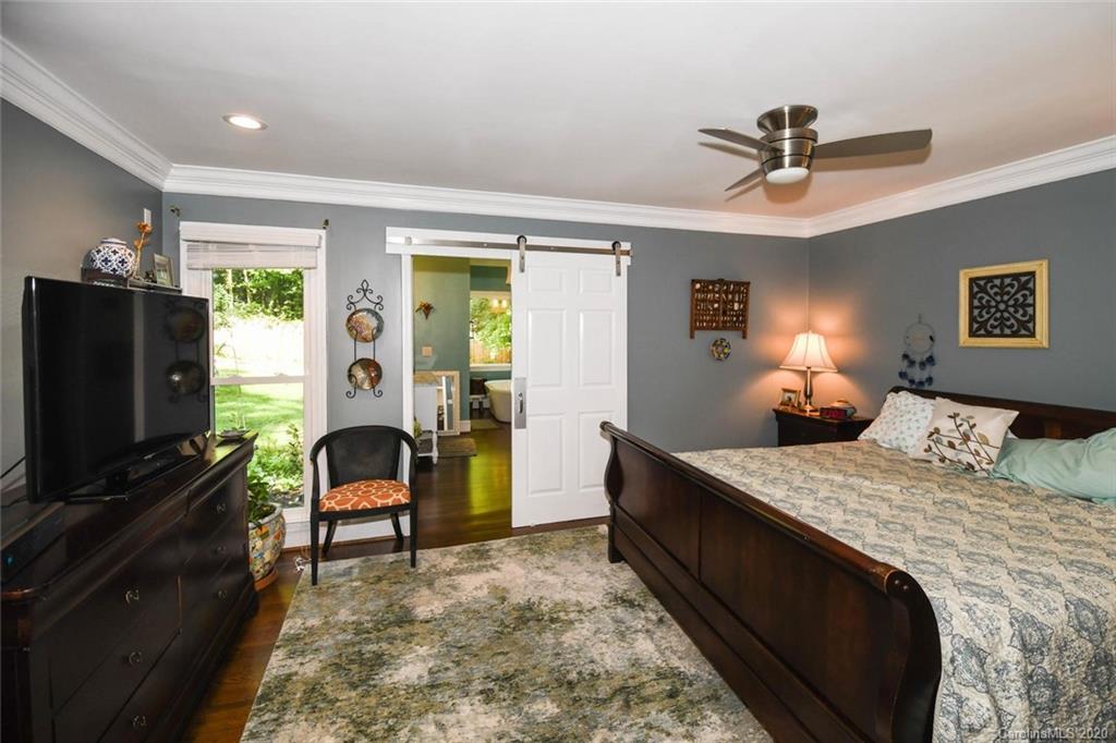 5644 Londonderry Road Charlotte, NC 28210 - Photo 14 of 23 a bedroom with a bed and a flat screen tv