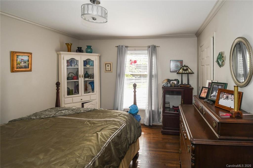 5644 Londonderry Road Charlotte, NC 28210 - Photo 18 of 23 a bedroom with a bed dresser and a window