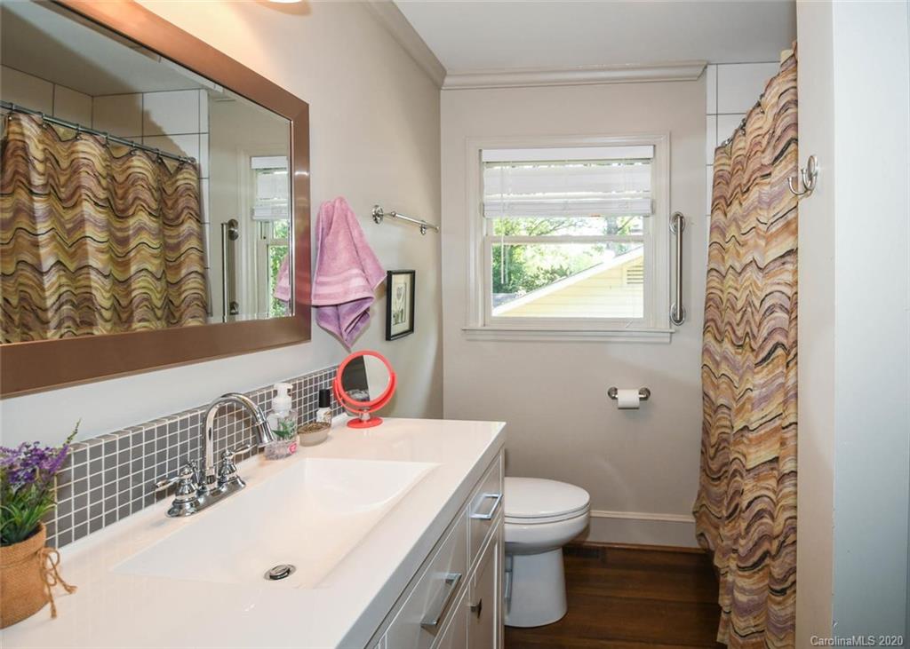 5644 Londonderry Road Charlotte, NC 28210 - Photo 19 of 23 a bathroom with a sink toilet and a mirror