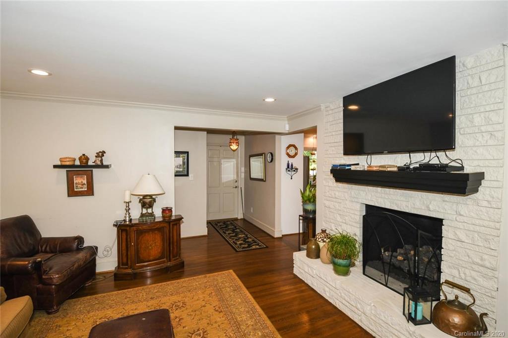 5644 Londonderry Road Charlotte, NC 28210 - Photo 5 of 23 a living room with furniture a flat screen tv and a fireplace