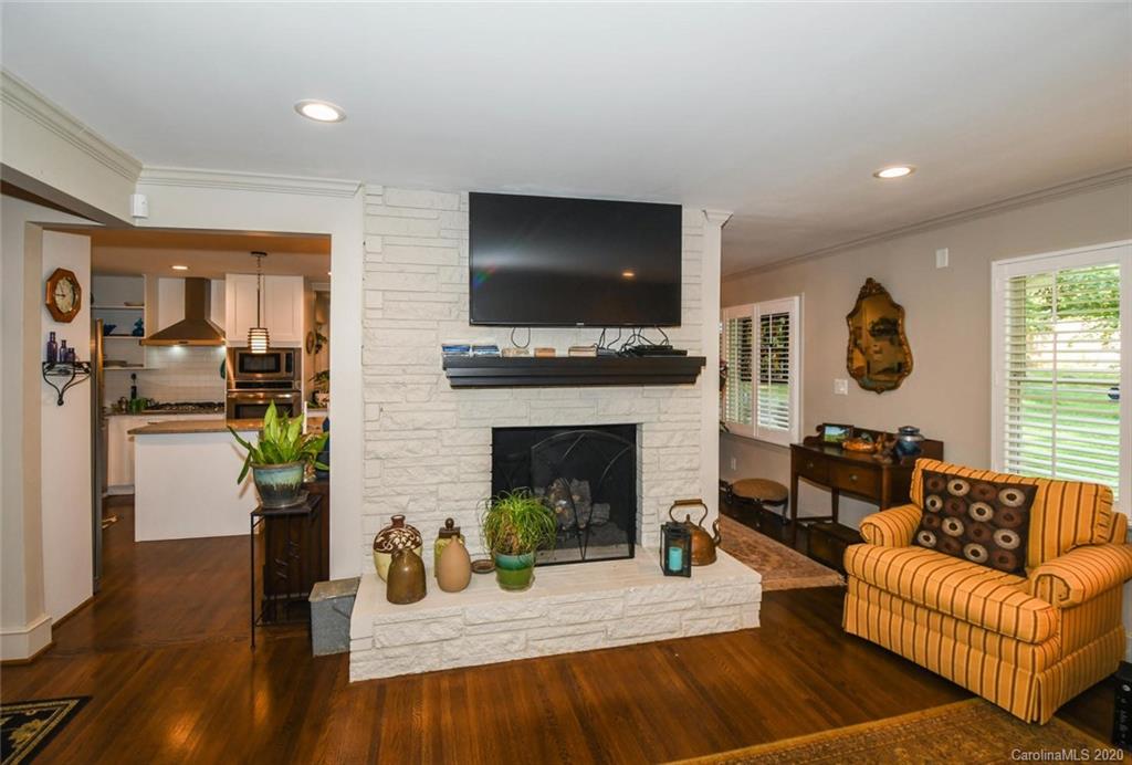 5644 Londonderry Road Charlotte, NC 28210 - Photo 6 of 23 a living room with furniture fireplace and flat screen tv
