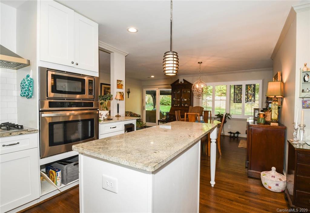 5644 Londonderry Road Charlotte, NC 28210 - Photo 9 of 23 a open kitchen with stainless steel appliances granite countertop a stove oven and a refrigerator