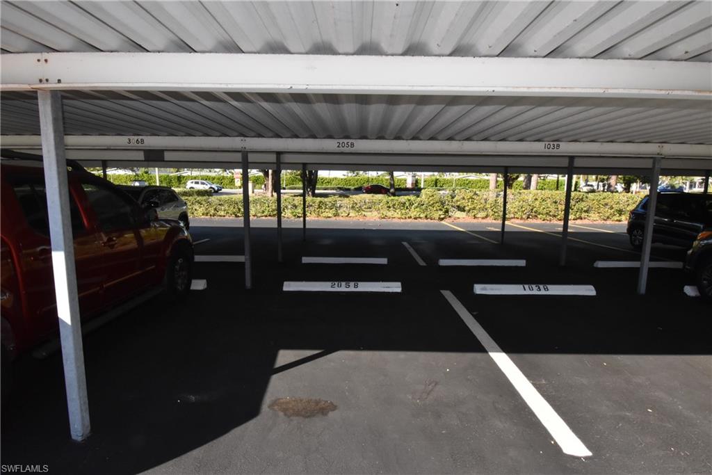 5667 Rattlesnake Hammock Road, Unit B205 Naples, FL 34113 - Photo 2 of 16 View of covered parking lot