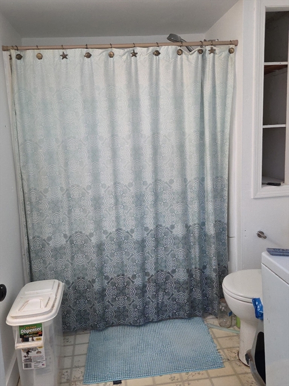 920 Worcester Road Barre, MA 01005 - Photo 23 of 40 a bathroom with a toilet and a shower curtain
