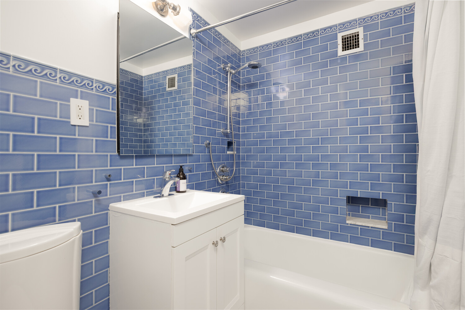 11 Riverside Drive, Unit 8JHW Manhattan, NY 10023 - Photo 10 of 15 a bathroom with a sink a toilet and shower