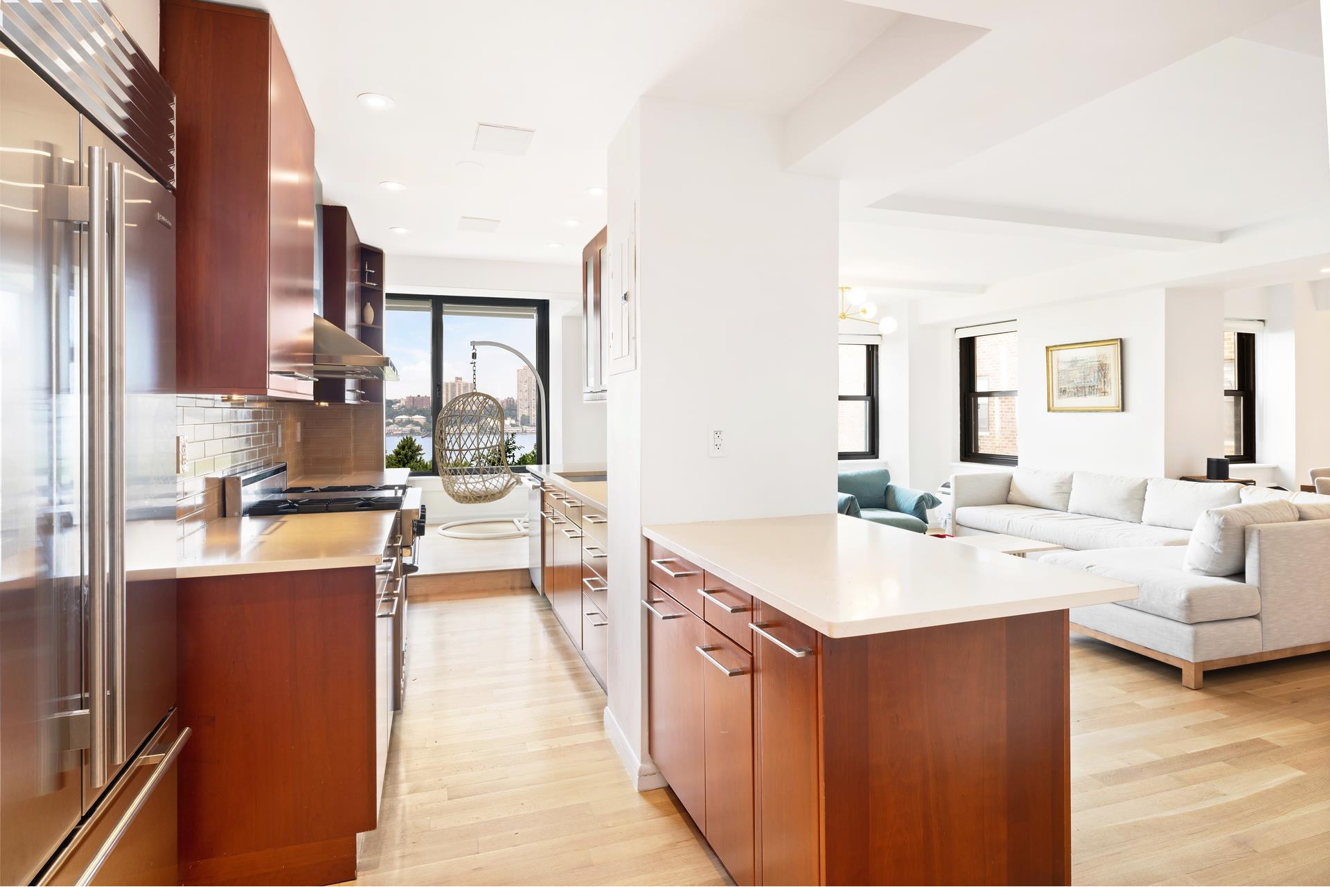 11 Riverside Drive, Unit 8JHW Manhattan, NY 10023 - Photo 4 of 15 a view of living room with granite countertop furniture and a fireplace