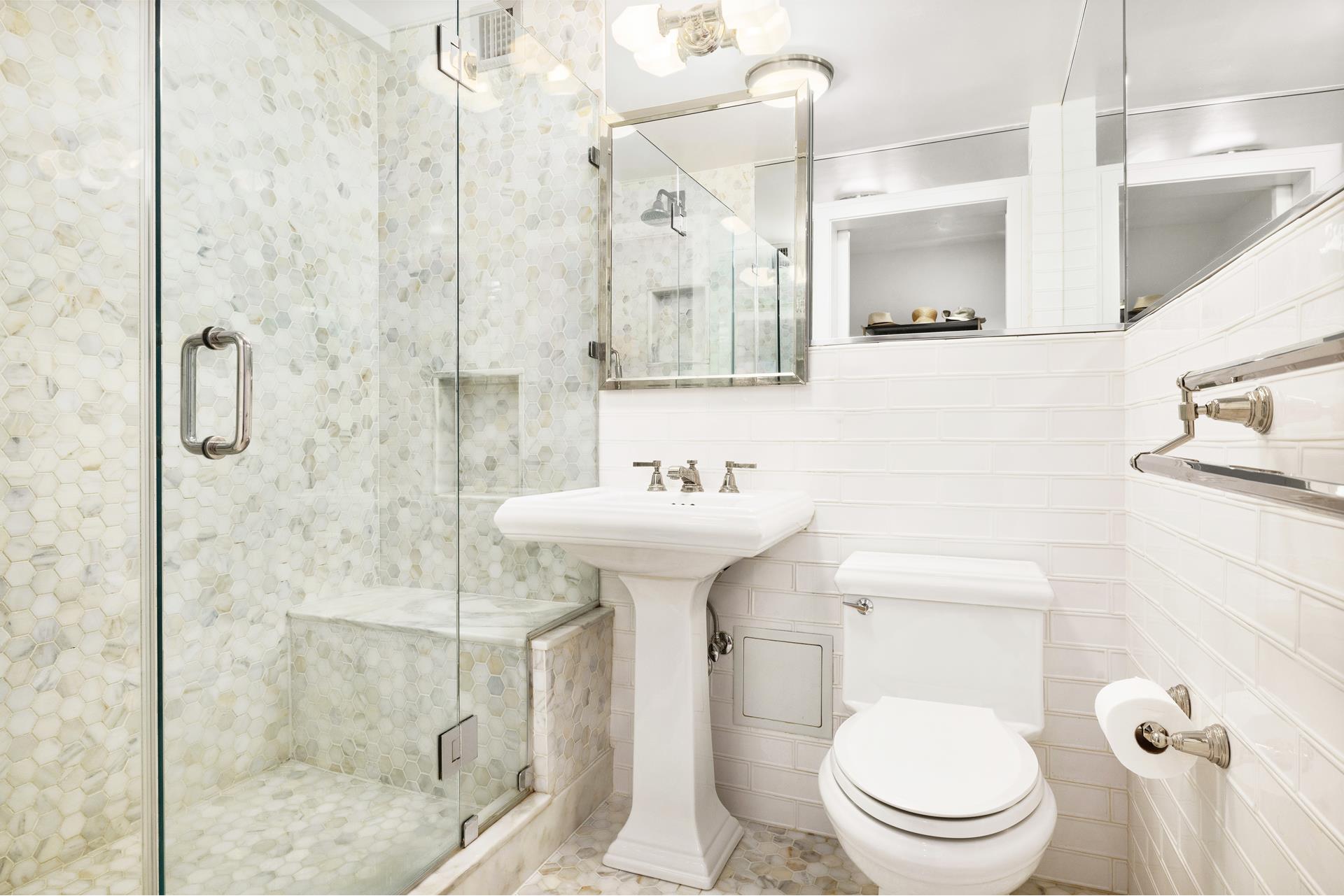 11 Riverside Drive, Unit 8JHW Manhattan, NY 10023 - Photo 7 of 15 a bathroom with a sink toilet and shower